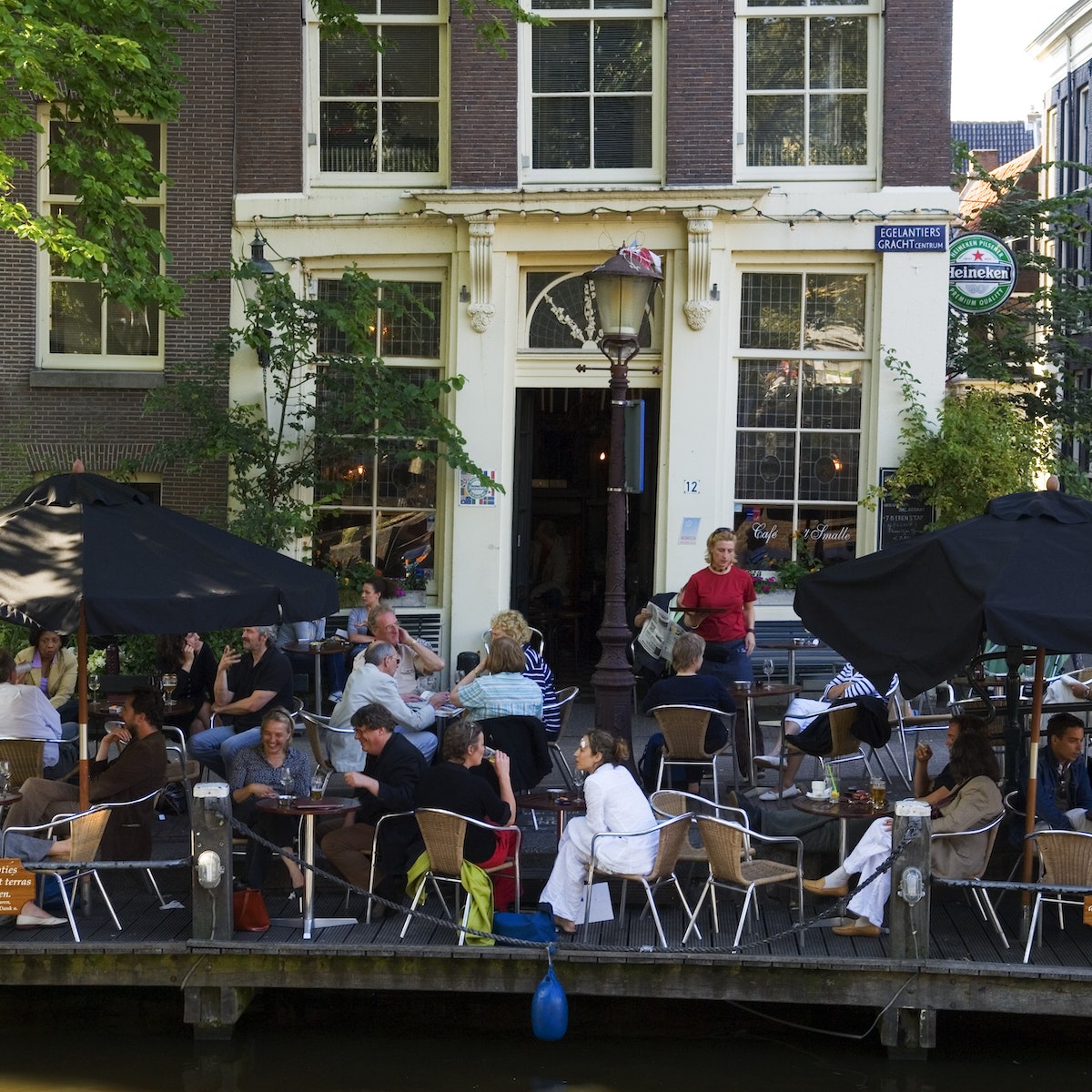 Exterior of Cafe't Small during late afternoon in Jordaan area.