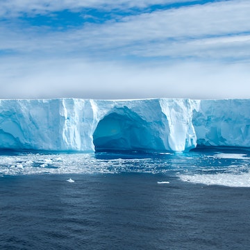 Beautiful blue iceberg and ice floe in Admiralty bay, King George Island Antarctica.