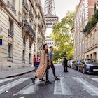 Lovely couple spending some days in vacation to Paris close to Tour Eiffel.