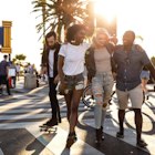 Group of friends in Santa Monica - Los Angeles - Have fun during a vacation
1159412306
A group of friend laughing as they walk along a street in Santa Monica together