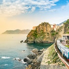 Manarola, Cinque Terre - train station in small village with colorful houses on cliff overlooking sea. Cinque Terre National Park with rugged coastline is famous tourist destination in Liguria, Italy
1167623137
5 terre