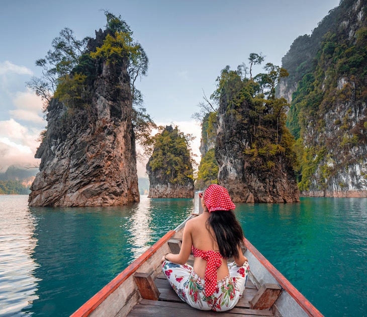 Asia Travel Thailand. Tourists in red bikini sets are holding hands with fun on the boat at Khao Sok National Park, Chiewlarn Dam, Thailand. Chiao Lan Khao Sok Dam is a tourist attraction in Surat Thani Province of Thailand.Happy woman traveler on boat her arms open feeling freedom, Ratchaprapa dam in KHAO SOK National Park, Thailand, Surat thani,Travel in Thailand, Beautiful destination Asia, Summer holiday outdoors vacation trip
1273413451