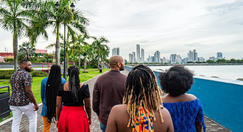 Rear View Following a Group of Cheerful, Fashionable Afro-Descendant Black Tourists Walking Together Taking in a View of Panama City, Panama from Plaza V Centenario with Copy Space
1426692017
A group of travelers on a walking tour of Panama City