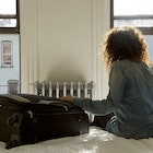 Female solo traveller sat on bed with suitcase looking out of the window in Brooklyn, New York.
599473197
Travel, Independence, Contemplation, Wanderlust, Traveller