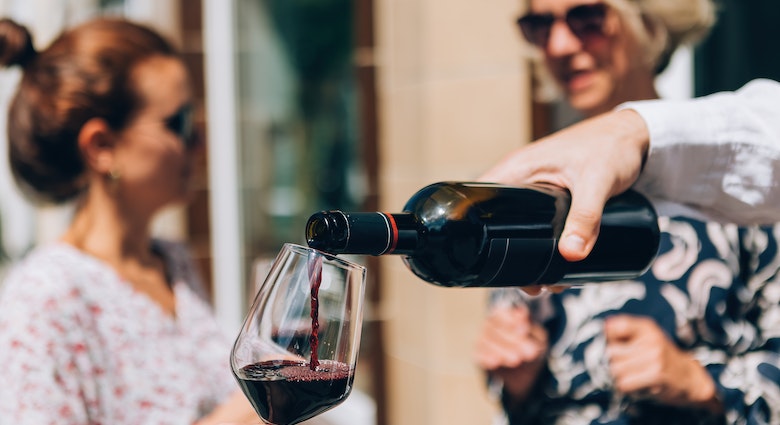 pouring red wine on glass at the aperitif happy hour wine tasting; Shutterstock ID 2182703537; full: 65050; gl: Online Editorial; netsuite: Bordeaux on a budget; your: Bailey Freeman
2182703537