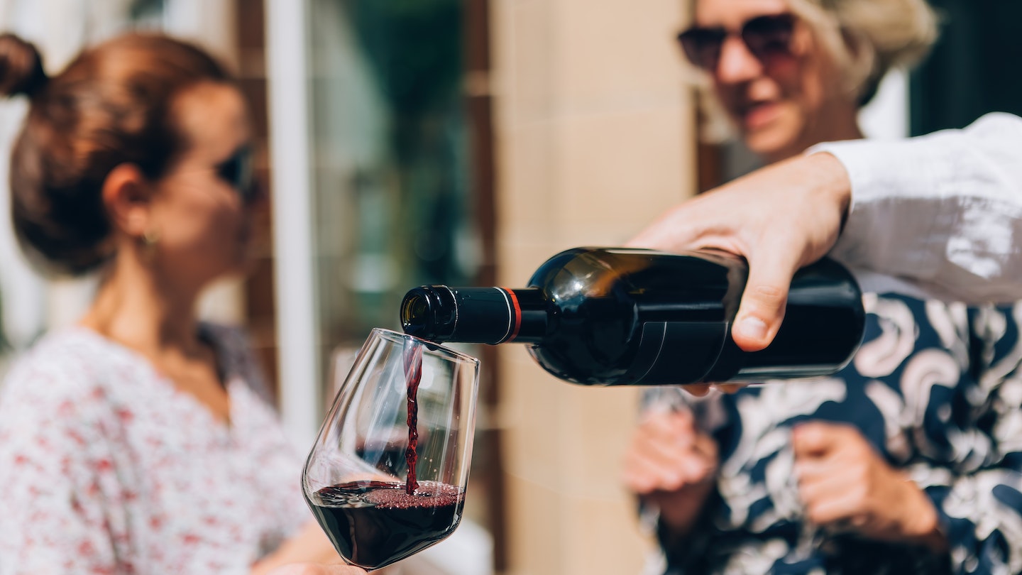 pouring red wine on glass at the aperitif happy hour wine tasting; Shutterstock ID 2182703537; full: 65050; gl: Online Editorial; netsuite: Bordeaux on a budget; your: Bailey Freeman
2182703537