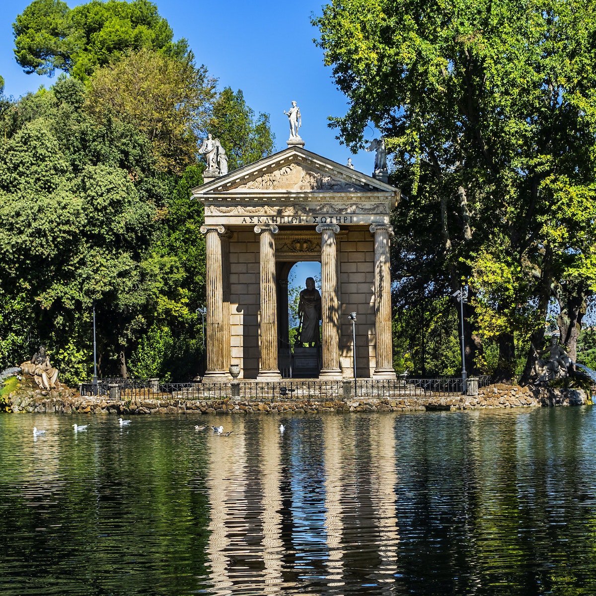 The lakeside Temple of Aesculapius in in the gardens of the Villa Borghese.
1168486960
ancient, architecture, art, attraction, capital, classical, culture, european, famous, gardens, historical, history, holiday, italia, italian, italy, landmark, monument, old, place, roma, roman, rome, sculpture, sightseeing, stone, temple, tourism, tourist, touristic, travel, vacation, villa borghese