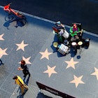 October 10, 2019: High-angle view of the Hollywood Boulevard walk of fame, as seen from the Hollywood & Highland entertainment center Dolby Theatre rooftop terrace.
1559045450
actor, actress, america, avenue, blvd, boulevard, building, california, cars, celebrity, cinema, city, county, dolby theatre, downtown, entertainment, fame, famous, film, glamour, highland, hollywood, landmark, los angeles, media, movie, music, oscar, outside, pedestrians, place, producer, shops, singer, star, starline, street, strip, sunset, theater, theatre, tile, tourism, tourist, traffic, urban, usa, view, walk, walk of fame