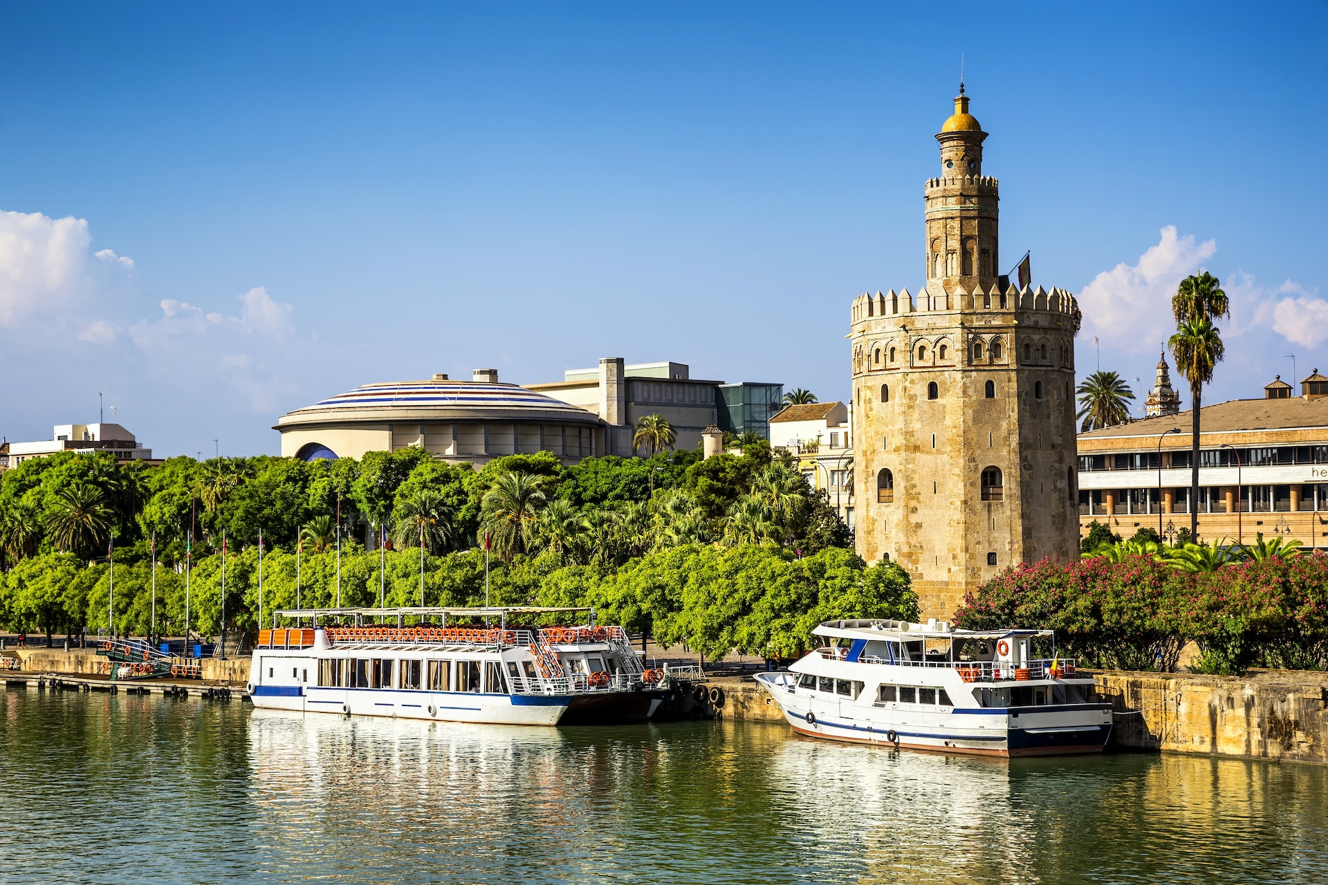 An imposing tower on the edge of a river