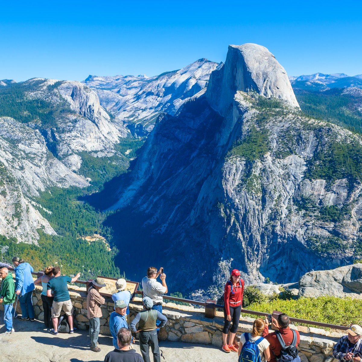 October 9, 2014: Visitors gather at Glacier Point with the Half Dome mountain in the background.