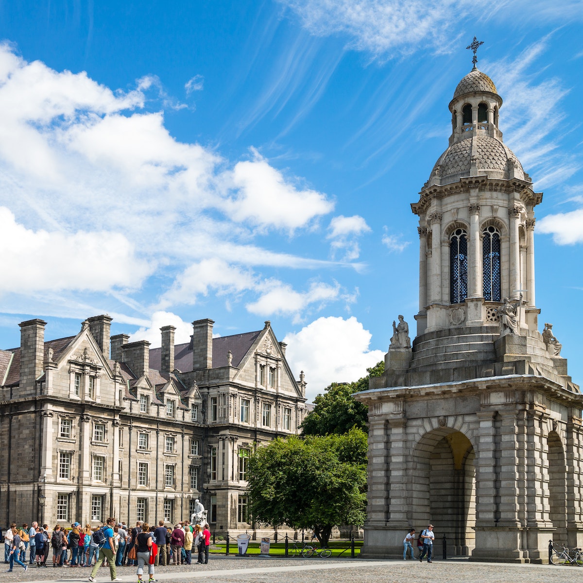 Dublin, Ireland - August 3, 2013: Visitors under the Campanile of the Trinity College