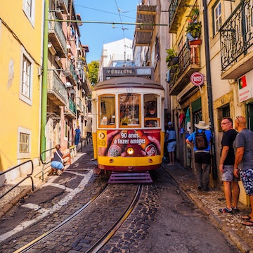 August 22, 2017: People stepping to the sidewalk in order to let the street car pass in the streets of Lisbon.
755689225
urban, tourist attraction, city center, pedestrian street, street tramway, front view, classic, horizontal, lisboa, old, old fashioned, people, portugal, portuguese, rail, rail transport vehicle, summer, tourism, transport, travel, yellow, alfama, busy, cable car, campo ourique, capital, center, city, cobblestone street, day, electric, famous, journey, known, line, martin moniz, moving aside, moving away, pavement, prazeres, sidewalk, sightseeing, stepping away, street, streetcar, sunny, tourists, tram, trolley car, unique