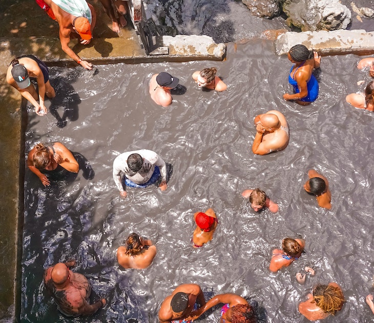 Soufriere, Saint Lucia - May 12, 2016: The tourists swimming at the Sulphur Springs Drive in volcano near Soufriere on 12 may 2016 at Saint Lucia island
871361558