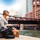 Woman listening to music by the Chicago River