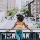 Beautiful american girl posing  in New york; Shutterstock ID 1310396668; your: Brian Healy; gl: 65050; netsuite: Lonely Planet Online Editorial; full: Best free things to do in New York